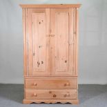 A modern pine double wardrobe, with drawers below 114w x 60d x 189h cm