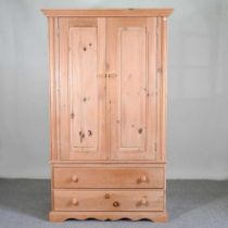 A modern pine double wardrobe, with drawers below 114w x 60d x 189h cm