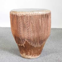 An African drum, with a hide top 42w x 45h cm