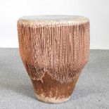 An African drum, with a hide top 42w x 45h cm