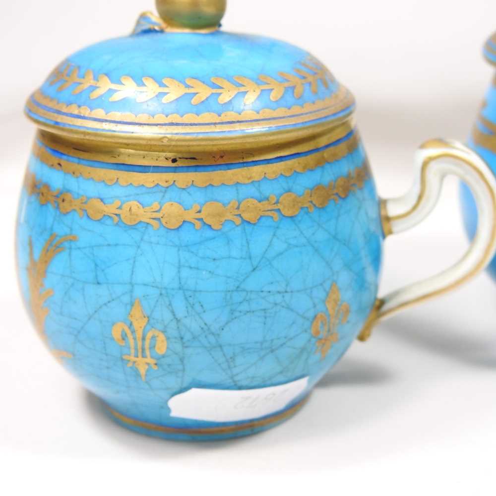 A set of eight 19th century Sevres porcelain custard cups and covers, with gilt decoration on a blue - Image 6 of 15