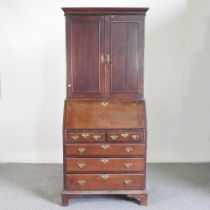 An 18th century oak bureau cabinet, on bracket feet 85w x 50d x 201h cm