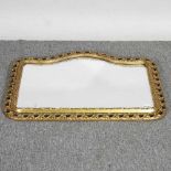 A gilt framed wall mirror, with an openwork surround, 50 x 66cm