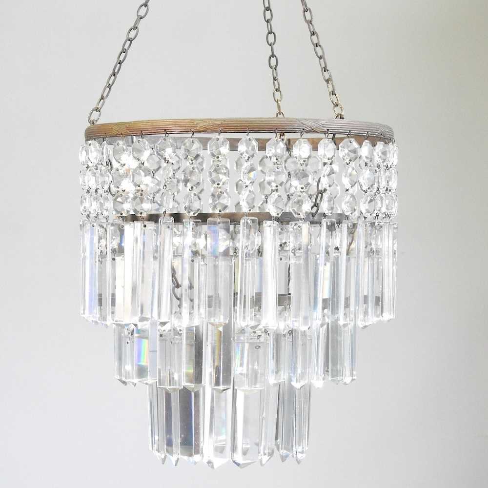 A glass chandelier, with prism shaped drops, 32cm diameter