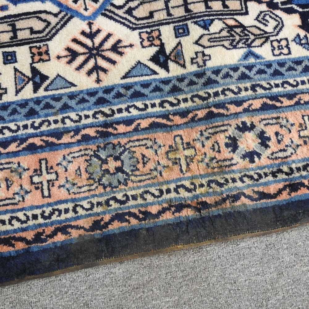 A Turkish woollen rug, with a central medallion, on a blue ground, 256 x 159cm - Image 6 of 6