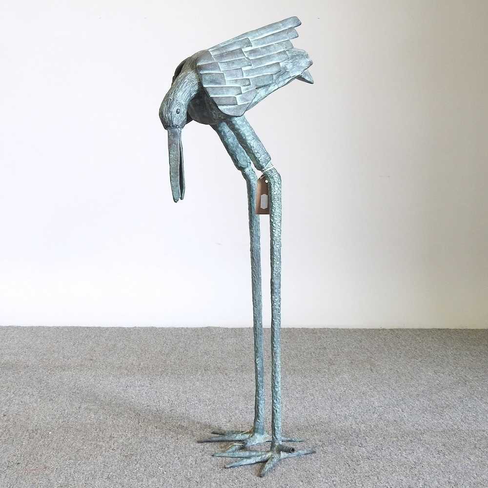 A verdigris metal garden fountain, in the form of a heron, 76cm high Overall condition is