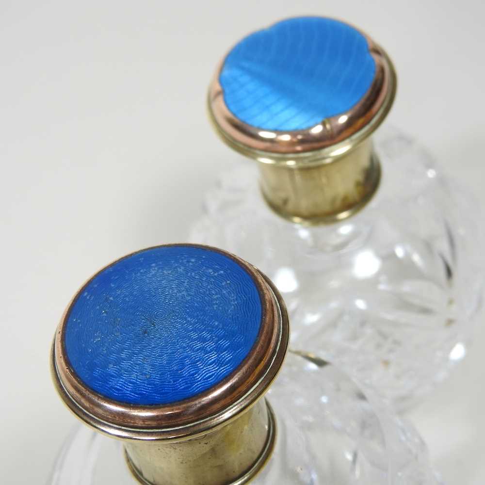 A cut glass scent bottle, with a gilt and blue enamel cover, 12cm high, together with another - Image 3 of 6