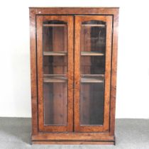 A Victorian pollard oak and oak glazed bookcase, fitted with shelves on a plinth base 110w x 33d x