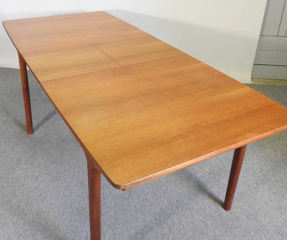 A 1970's teak extending dining table, with two additional leaves, bearing a label for A H McIntosh & - Image 3 of 5