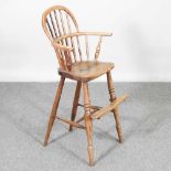 A 19th century elm Windsor style child's spindle back high chair, on turned legs, 86cm high