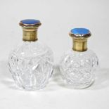 A cut glass scent bottle, with a gilt and blue enamel cover, 12cm high, together with another