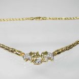 A fancy link necklace, suspended with three elephants, each set with zircons, marked 750, 20g,