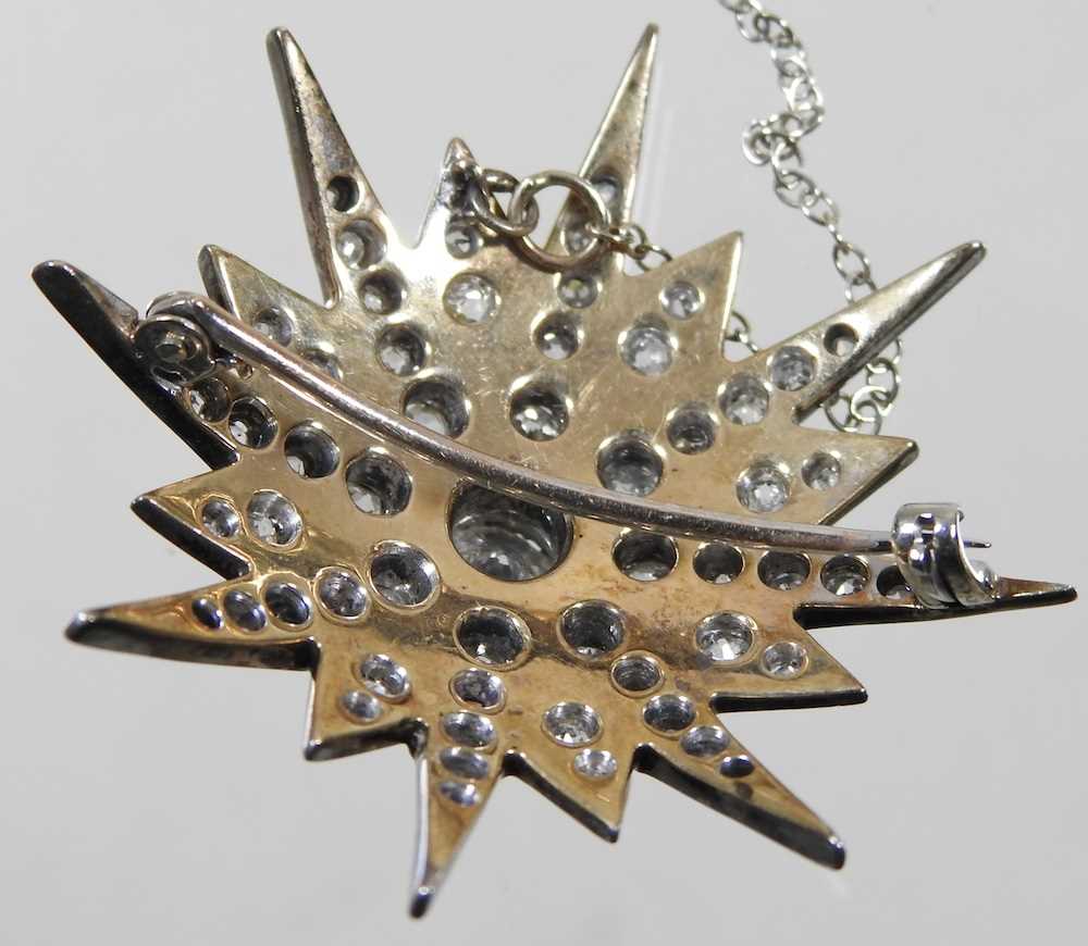 A diamond target brooch, of graduated star shape, with a pin back, unmarked, 11.8g, 4cm wide - Image 3 of 4