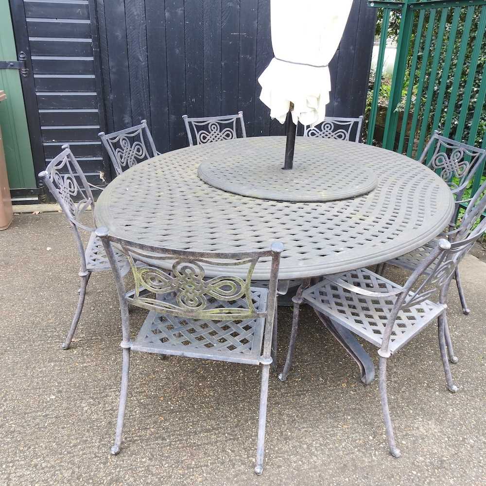 A large cast metal oval garden table, together with a set of eight garden chairs and a parasol base, - Image 4 of 5