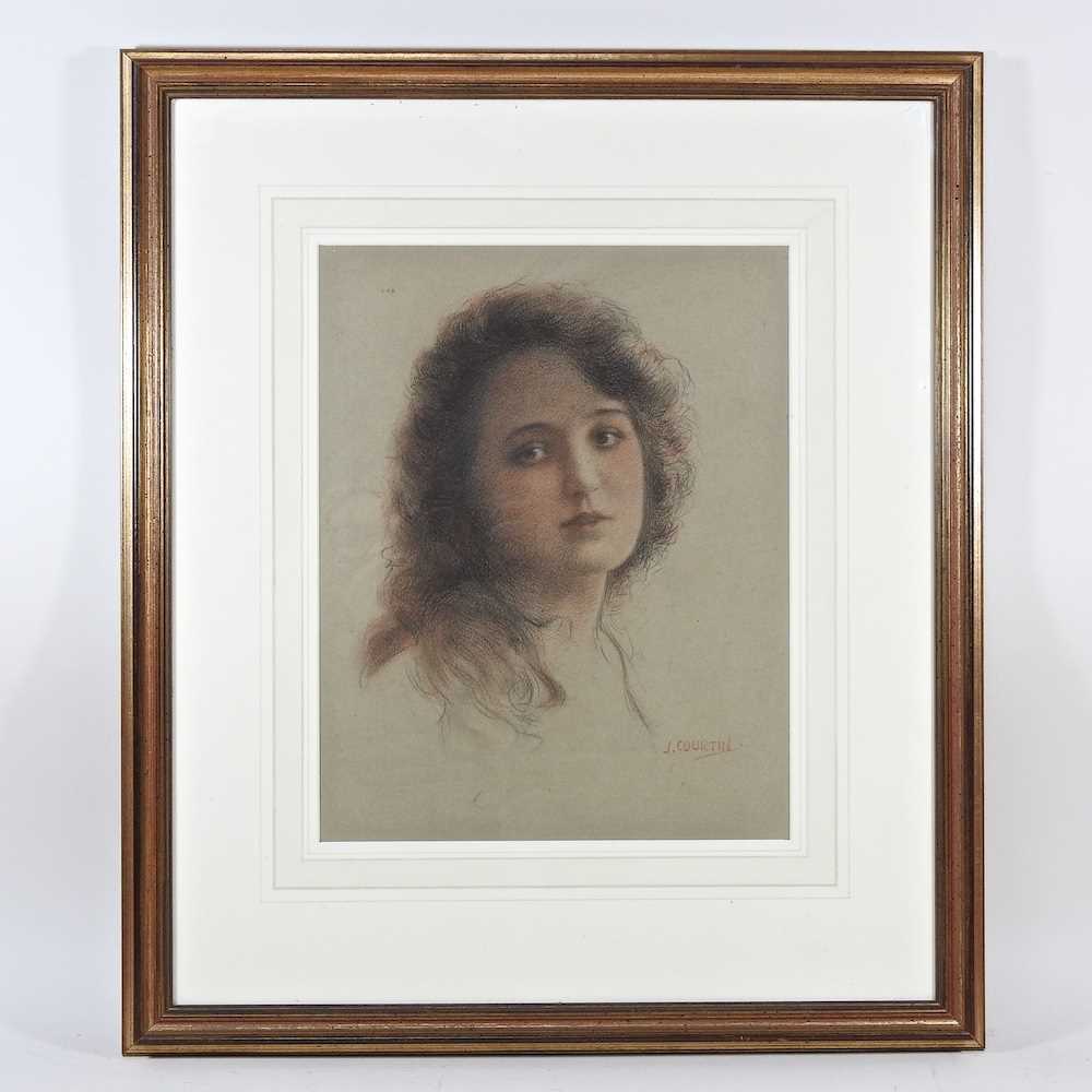 J Courtin, late 19th/early 20th century, head of a lady, signed pencil and chalk on paper, 33 x