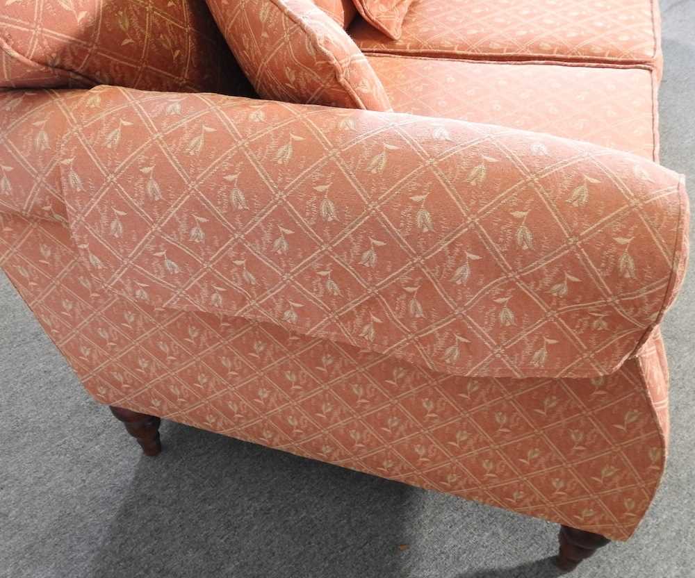 A modern peach upholstered sofa, recently re-upholstered, on turned feet 220w x 90d x 85h cm - Image 3 of 3