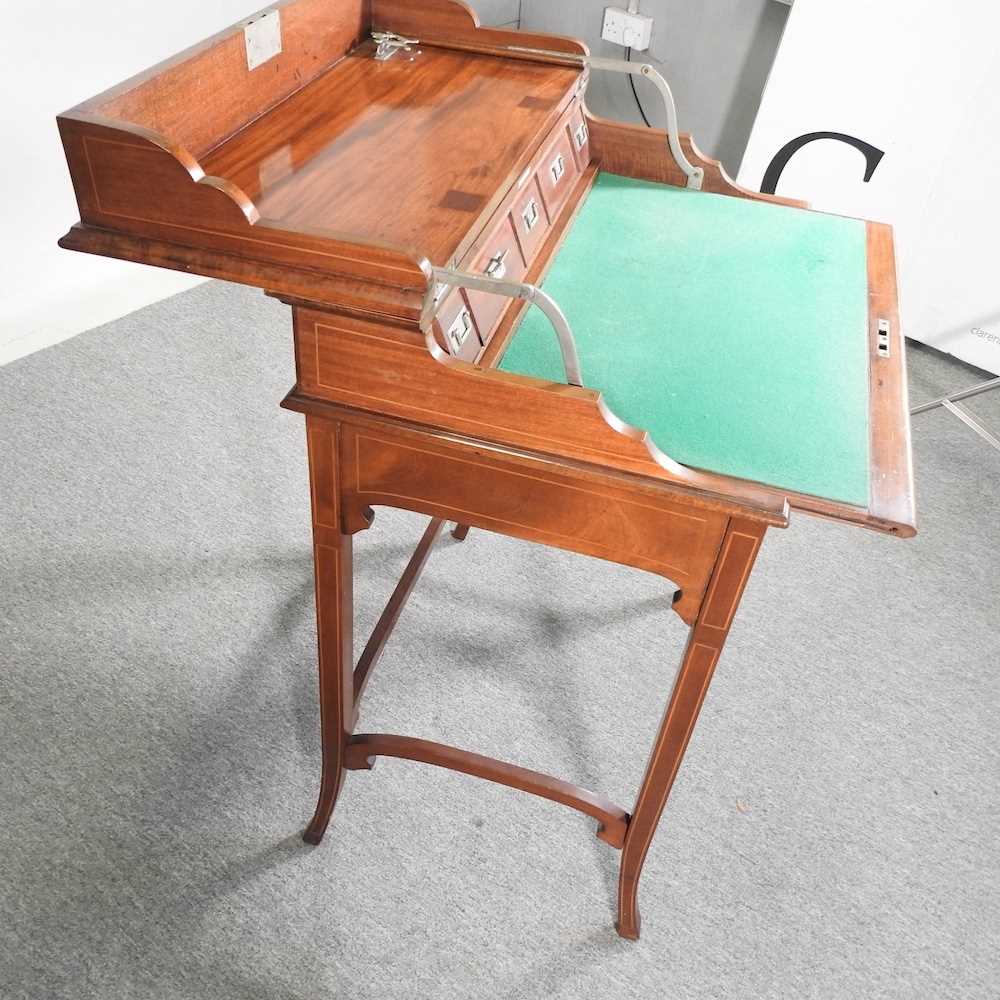 An early 20th century mahogany military style writing desk, with a dual hinged top, revealing a - Image 7 of 9