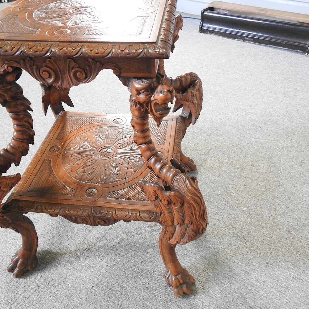 An early 20th century Italian carved walnut centre table, of Renaissance revival design, on four - Image 4 of 5