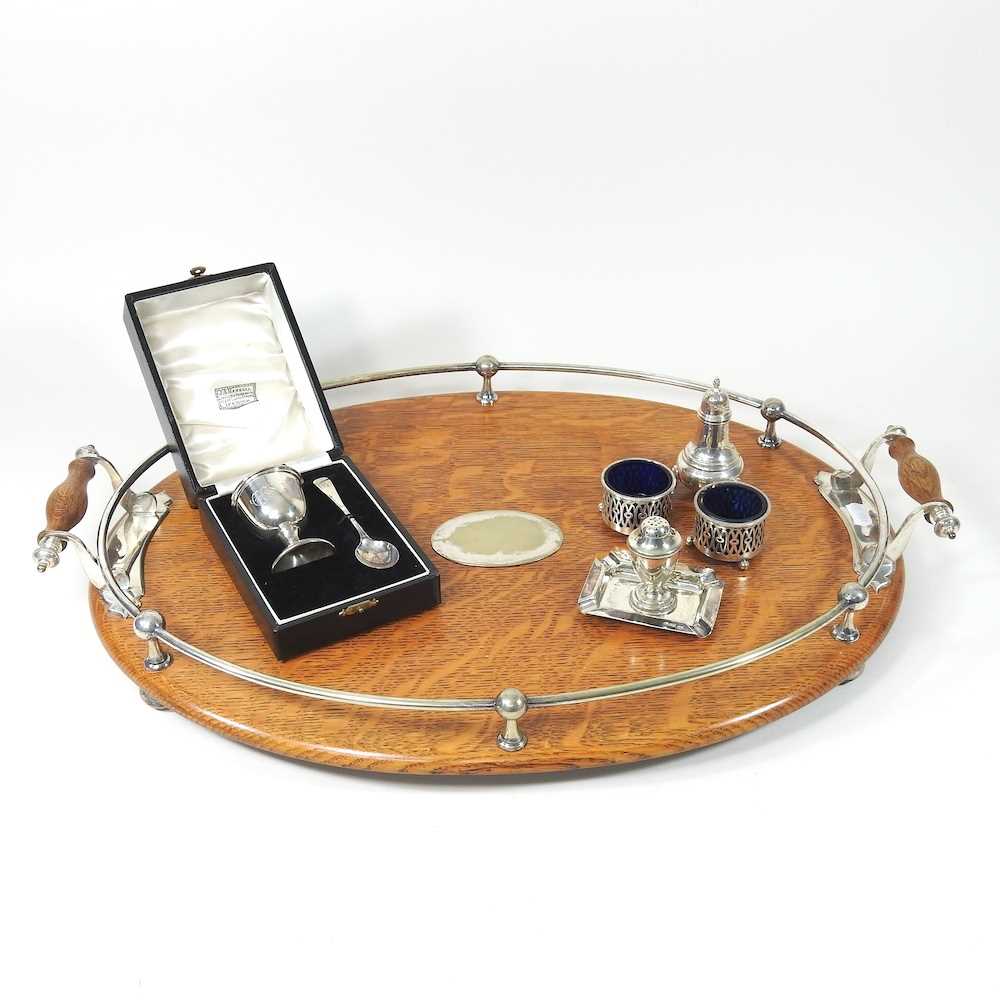 An early 20th century light oak serving tray, with silver plated mounts, 57cm wide, together with