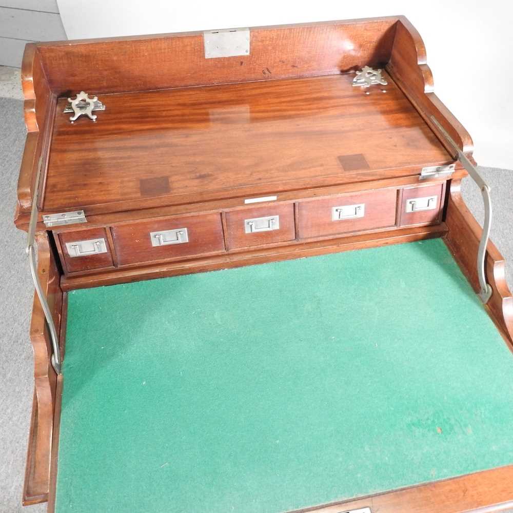 An early 20th century mahogany military style writing desk, with a dual hinged top, revealing a - Image 3 of 9