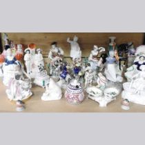 A Royal Copenhagen porcelain figure, together with a collection of 19th century and later figures,