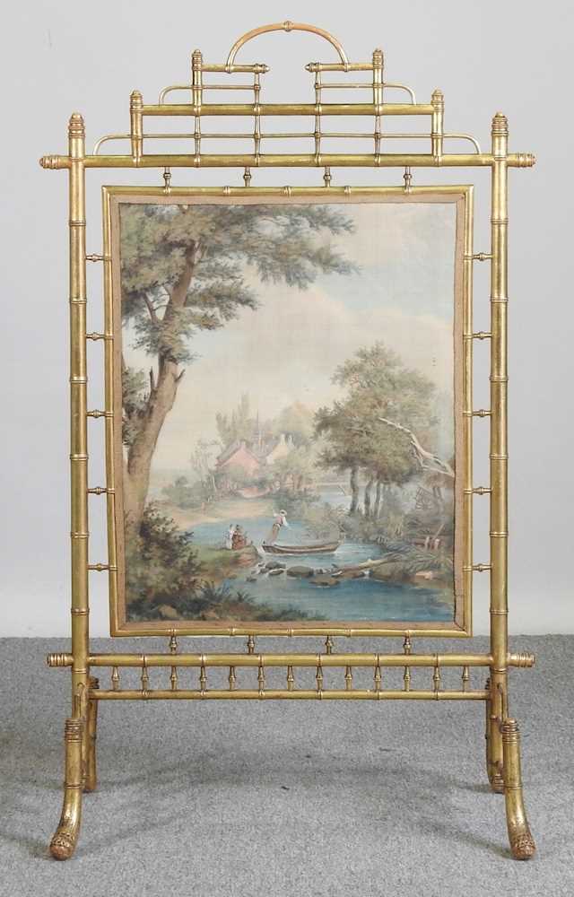 A 19th century simulated bamboo gilt fire screen, inset with a panel painted with a pastoral - Image 3 of 7