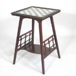 An Art Nouveau mahogany games table, in the manner of Shapland & Petter of Barnstaple, with a