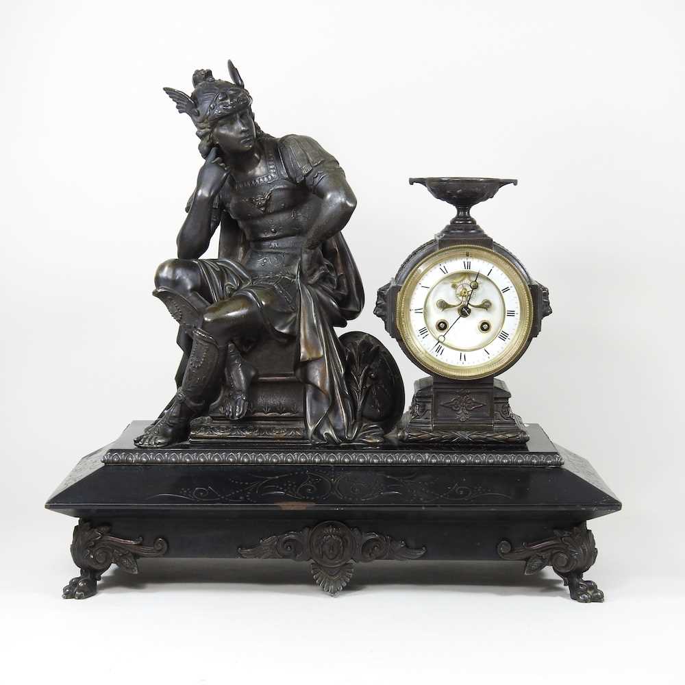 A 19th century gilt spelter figural mantel clock, surmounted by a figure of Hermes, with a white