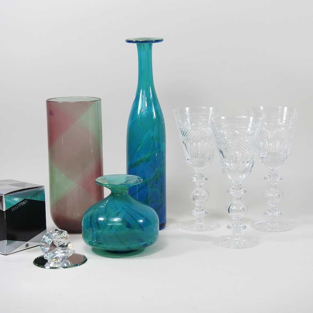 A set of three large cut crystal stem glasses, 22cm high, together with two M'dina coloured glass