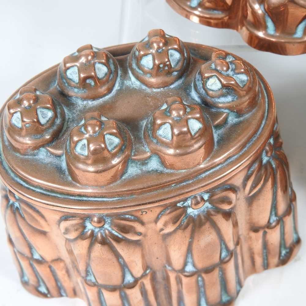 A Victorian copper jelly mould, stamped H. L. & Co, 12cm high, together with another similar and a - Image 3 of 8