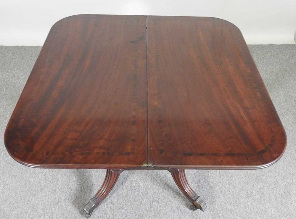 An unusual 19th century mahogany folding tea table, with a hinged rectangular top, on a carved U - Image 5 of 5