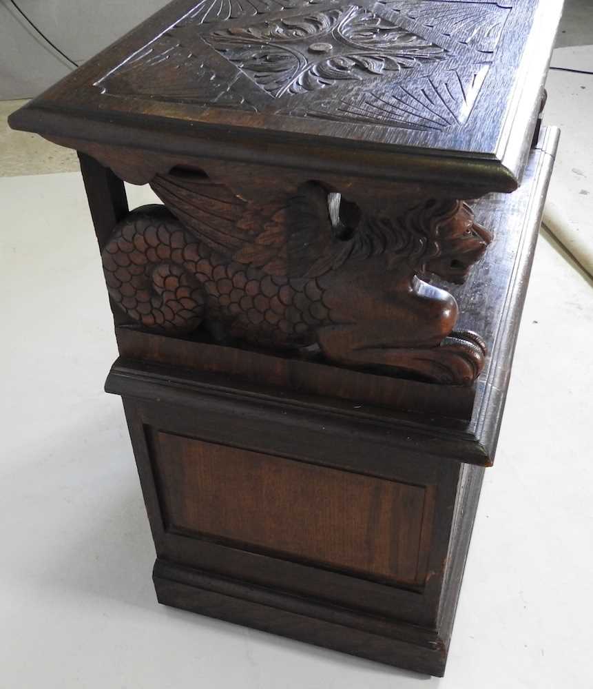 An early 20th century carved oak monk's bench, with griffin supports 92w x 50d x 82h cm - Image 7 of 10