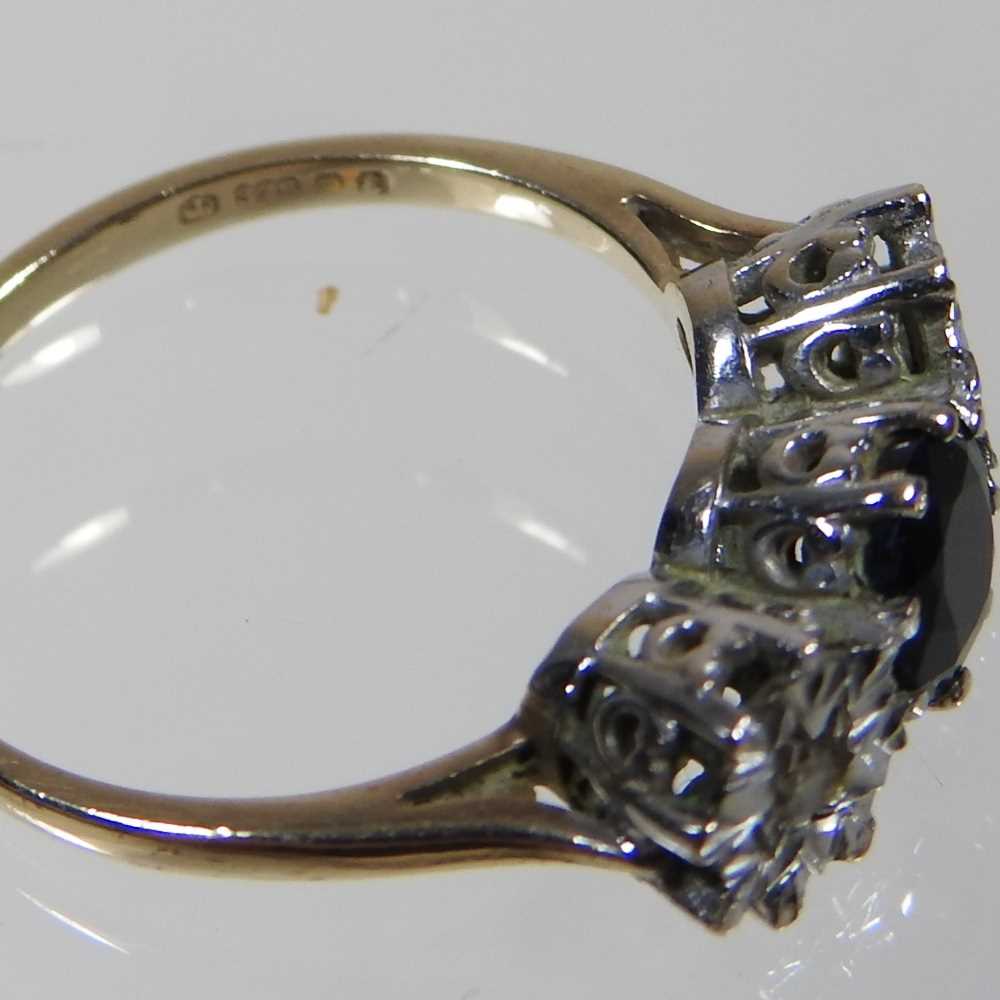 A 9 carat gold sapphire and diamond ring, the central brilliant cut sapphire, approximately 0.65 - Image 4 of 5