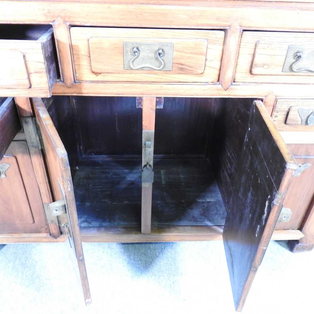 A modern Chinese hardwood sideboard, containing short drawers and cupboards 126w x 50d x 88h cm - Image 2 of 7