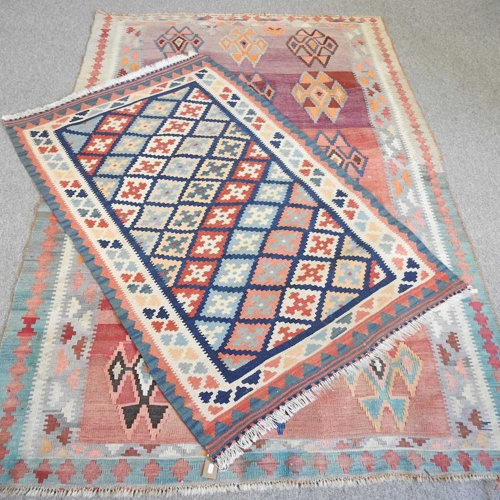 A kelim rug, with three rows of coloured diamonds, 240 x 146cm, together with another smaller, (2)