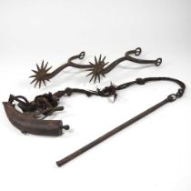 A pair of antique iron spurs, together with a 19th century powder flask (2)
