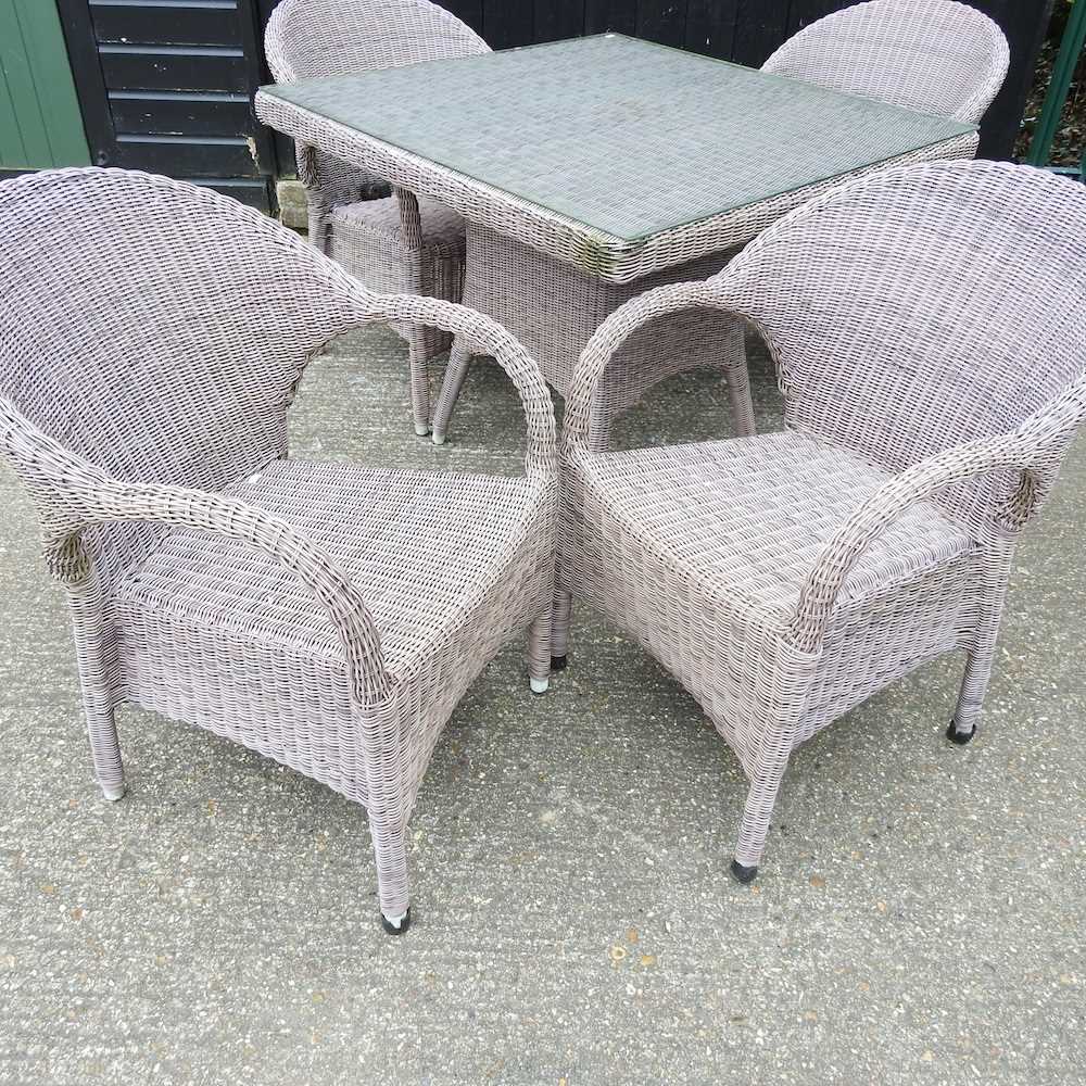 A Bridgman rattan garden table, with a glass top, together with a set of four matching armchairs - Image 3 of 4