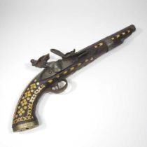 A middle Eastern flintlock pistol, with bone inlay, 40cm long Overall condition is complete. It is