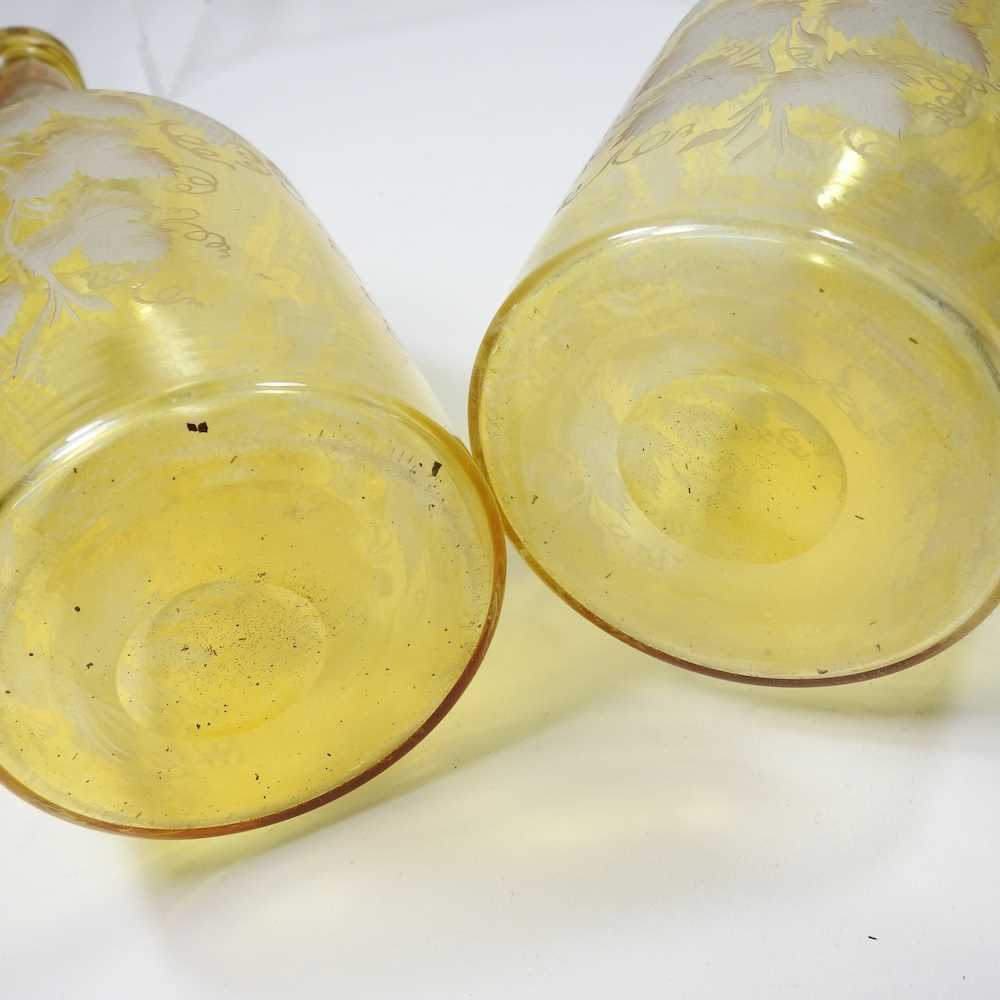 A pair of 19th century yellow overlaid glass wine bottles, each etched with hops, having a silver - Image 2 of 10