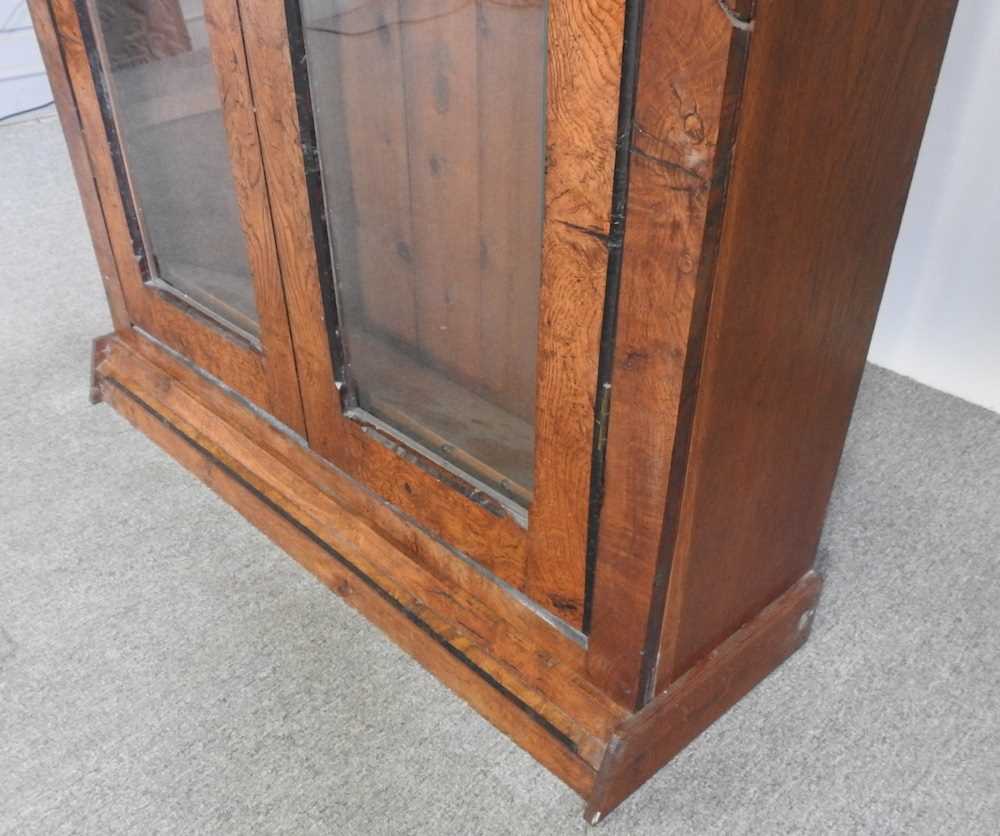 A Victorian pollard oak and oak glazed bookcase, fitted with shelves on a plinth base 110w x 33d x - Image 4 of 5