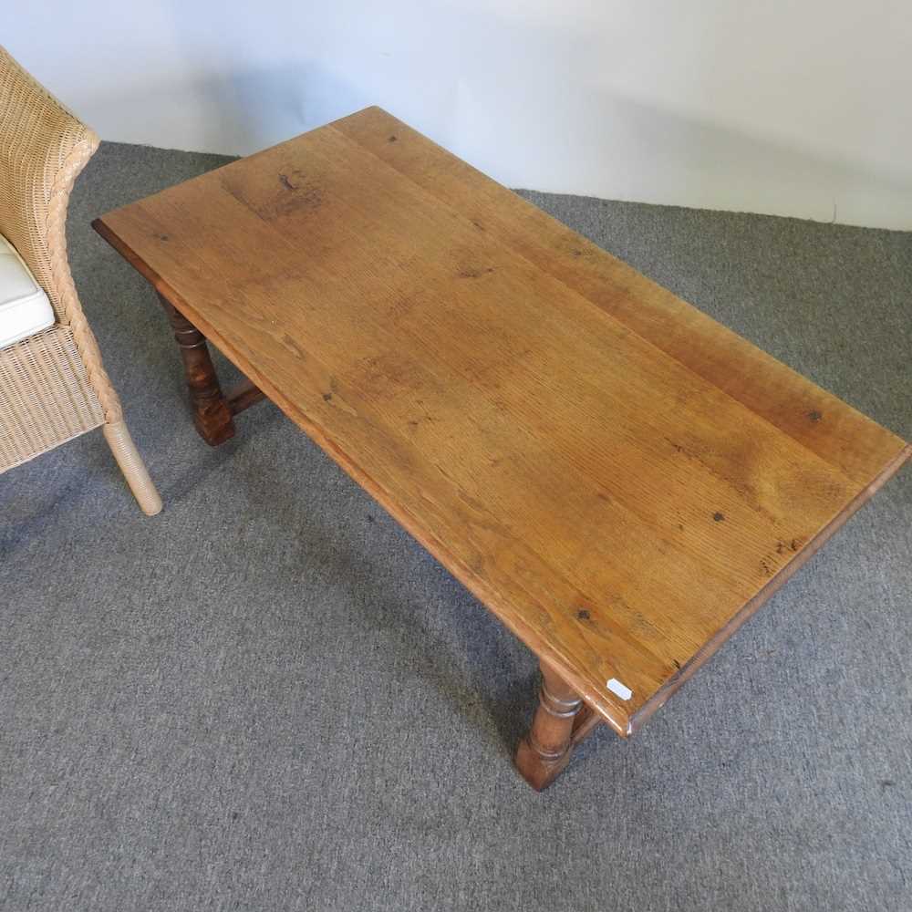 An oak coffee table, 107cm wide, together with a Lloyd Loom style bergere chair (2) - Image 3 of 3