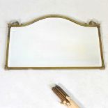An early 20th century brass framed wall mirror, 46 x 67cm, together with a collection of stair rods