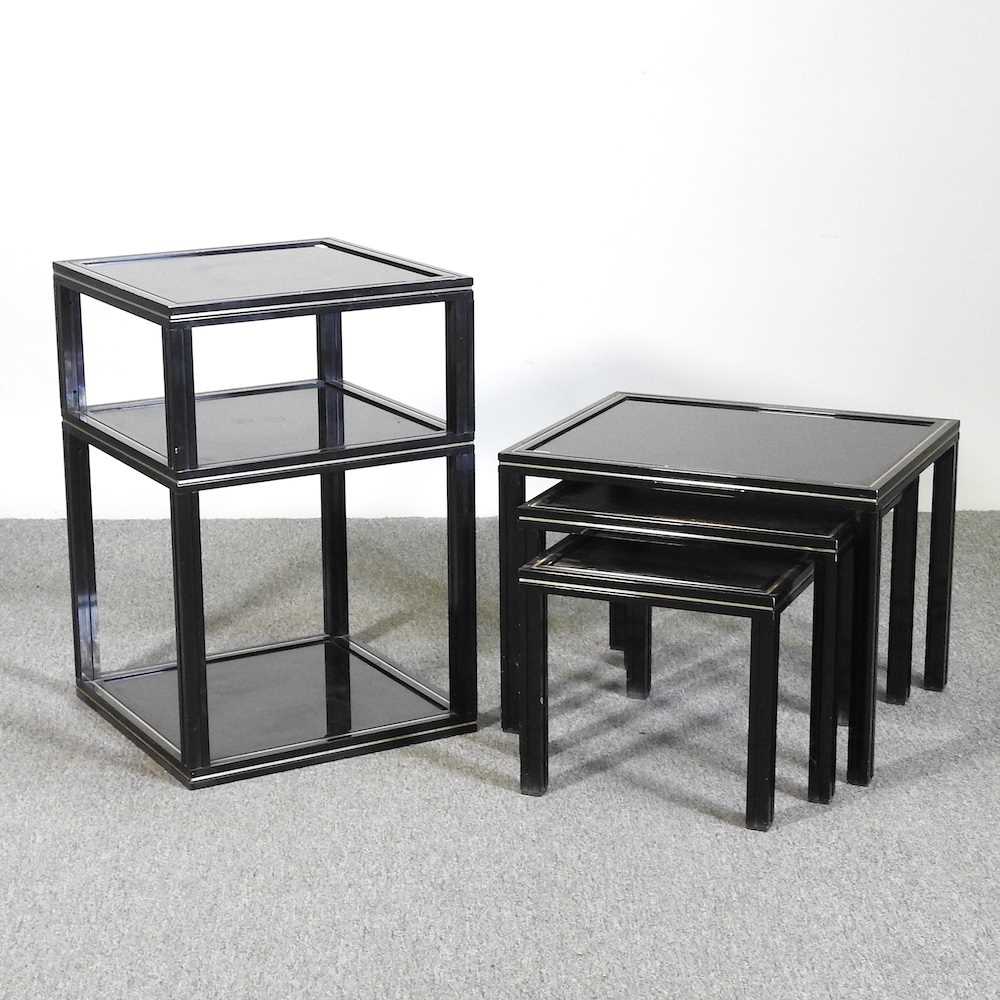 A Pierre Vandel black metal and glass two tier side table, together with a matching nest of