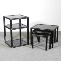 A Pierre Vandel black metal and glass two tier side table, together with a matching nest of