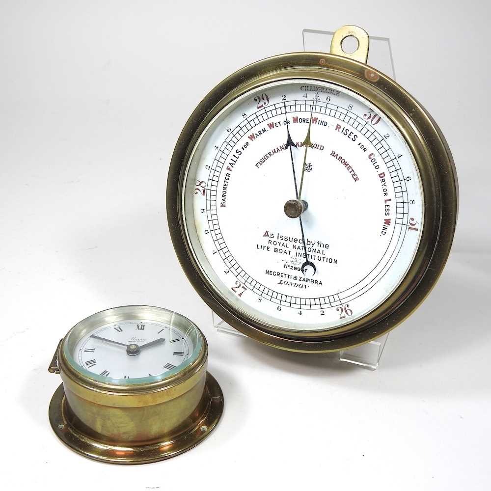 A Negretti & Zambra, London brass cased fisherman's aneroid barometer, issued by the national Life