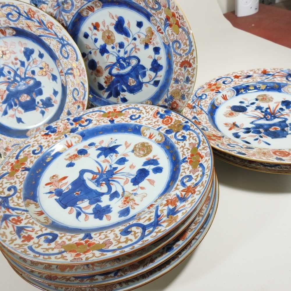 A collection of twelve 18th century Imari porcelain plates, each decorated with still life subjects, - Image 4 of 12