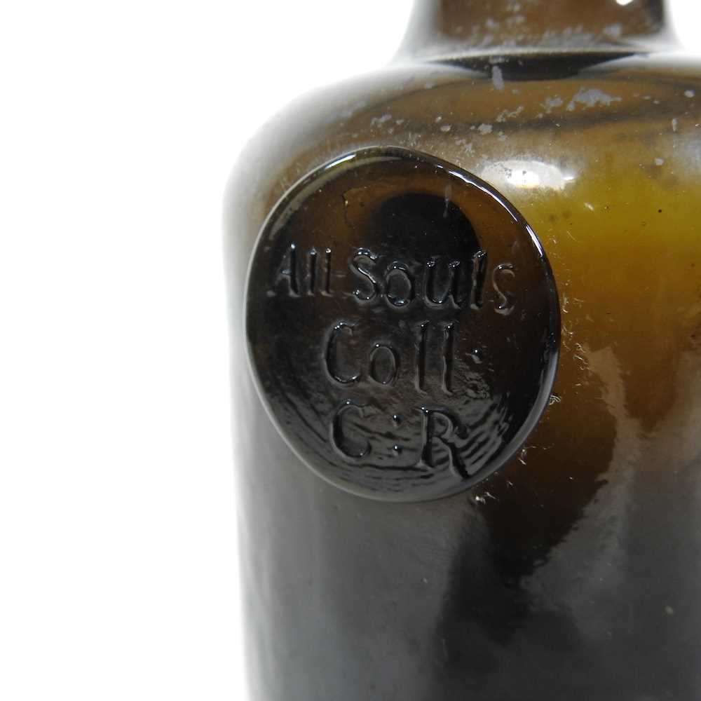 An 18th century English brown glass sealed wine bottle, inscribed All Souls Coll:C:R, 26cm high - Image 2 of 15