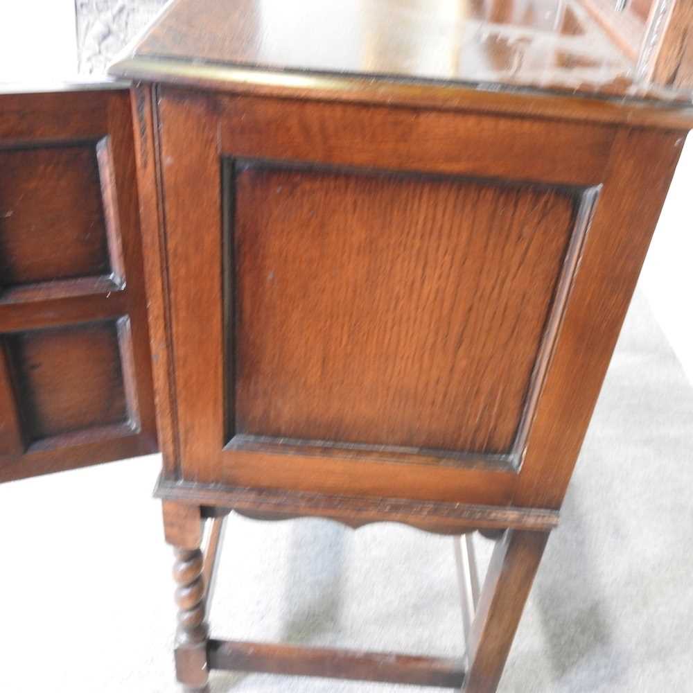 A 1920's Jacobean revival oak sideboard, on spirally turned legs 137w x 48d x115h cm - Image 7 of 7