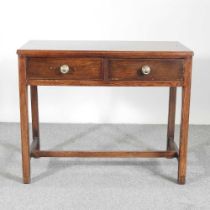 An early 20th century oak side table, containing two short drawers 99w x 50d x 82h cm