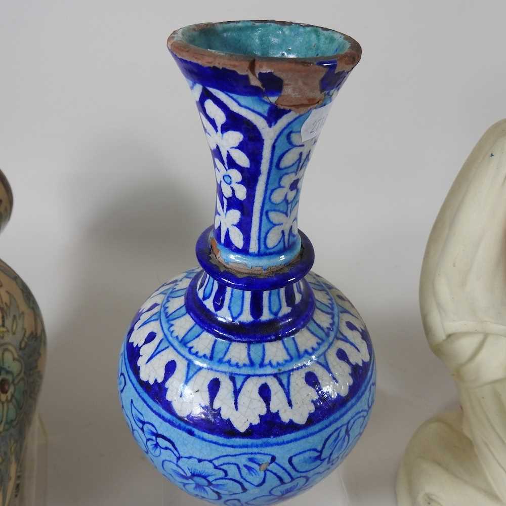 An Indian tin glazed pottery vase, of bottle shape, 24cm high, together with a collection of Persian - Image 4 of 9